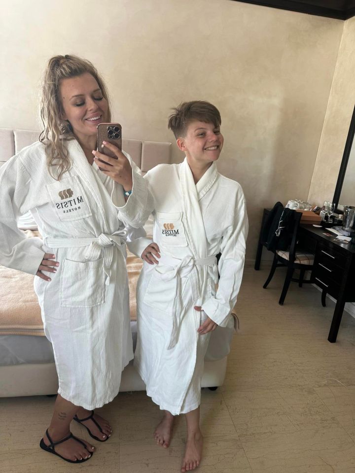 a woman and a boy wearing bathrobes with the word rizim on them