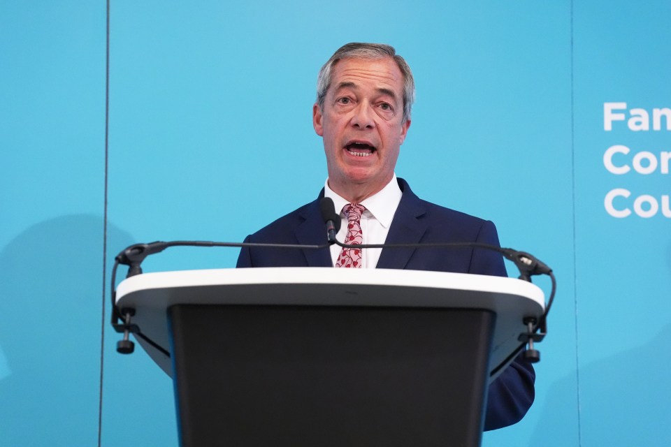 a man stands at a podium in front of a blue wall that says fan council