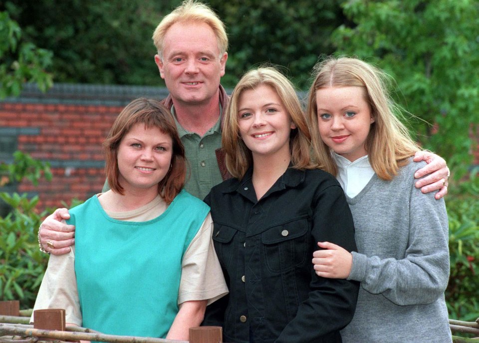 a man and three women pose for a picture together