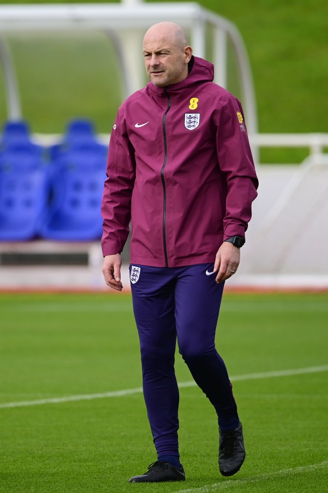 a man wearing a maroon jacket with england on it