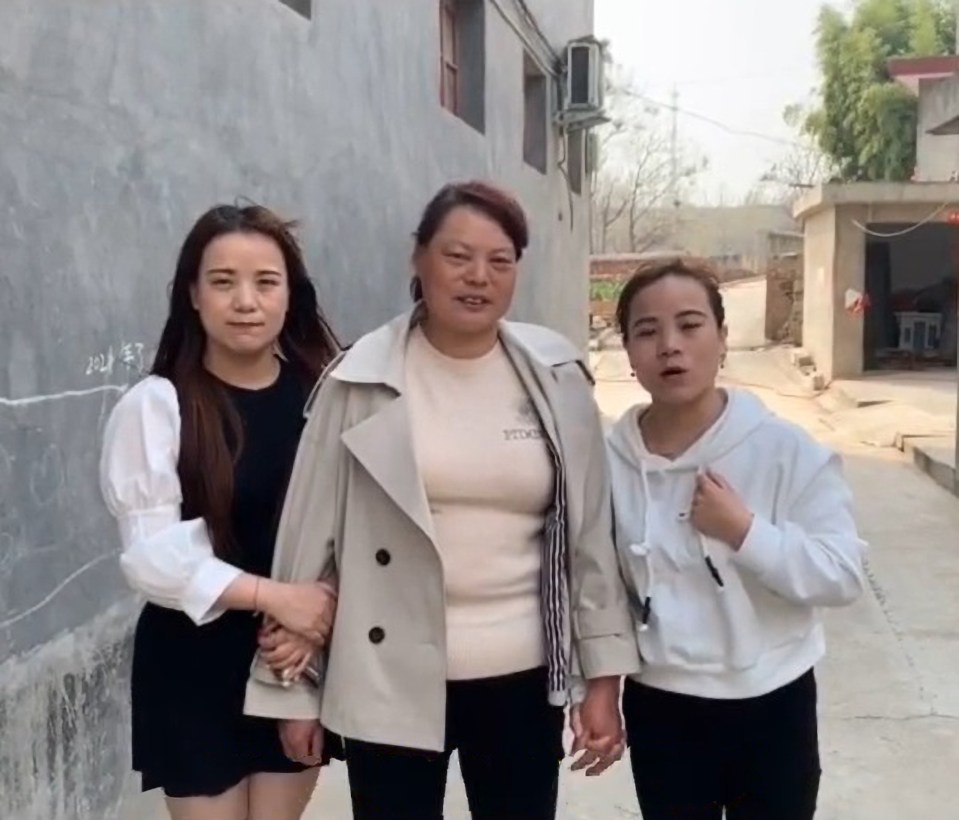 three women are standing next to each other and one of them is wearing a shirt that says yes