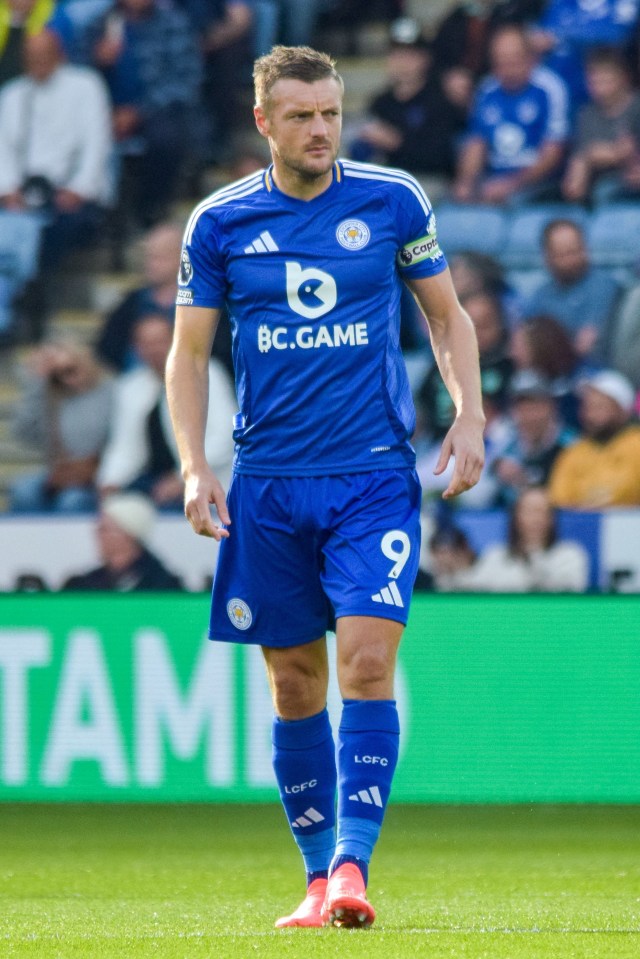 a soccer player wearing a blue jersey that says bc game