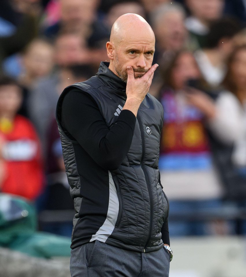 a bald man wearing a black vest with the word adidas on it