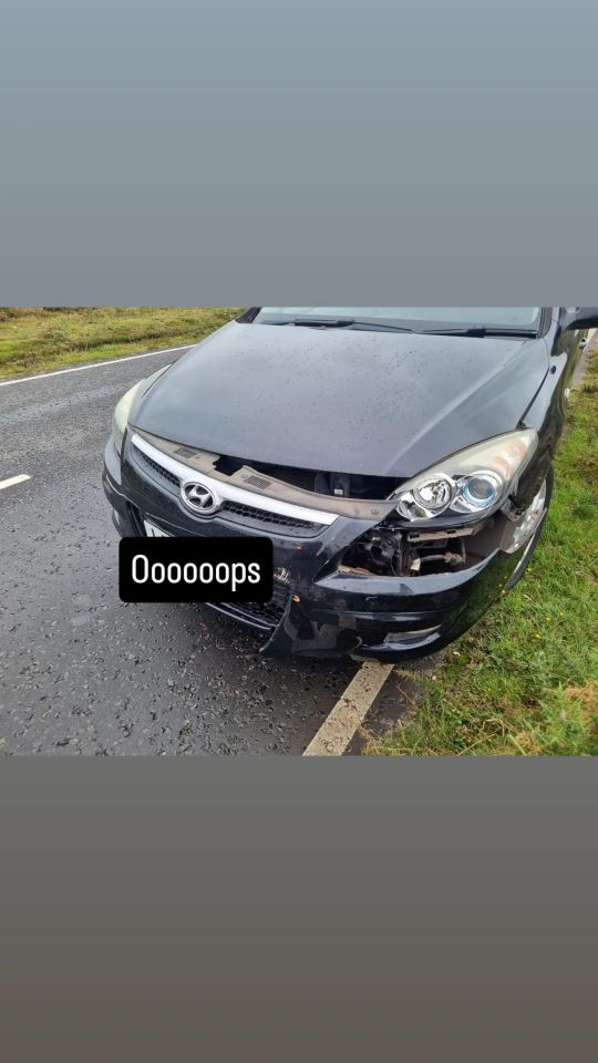 a black hyundai car that has been damaged in an accident