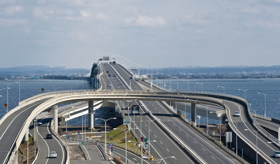 The whole thing is connected to land by a towering sea bridge