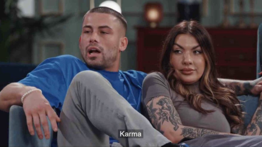 a man and a woman are sitting on a couch with the word karma above them