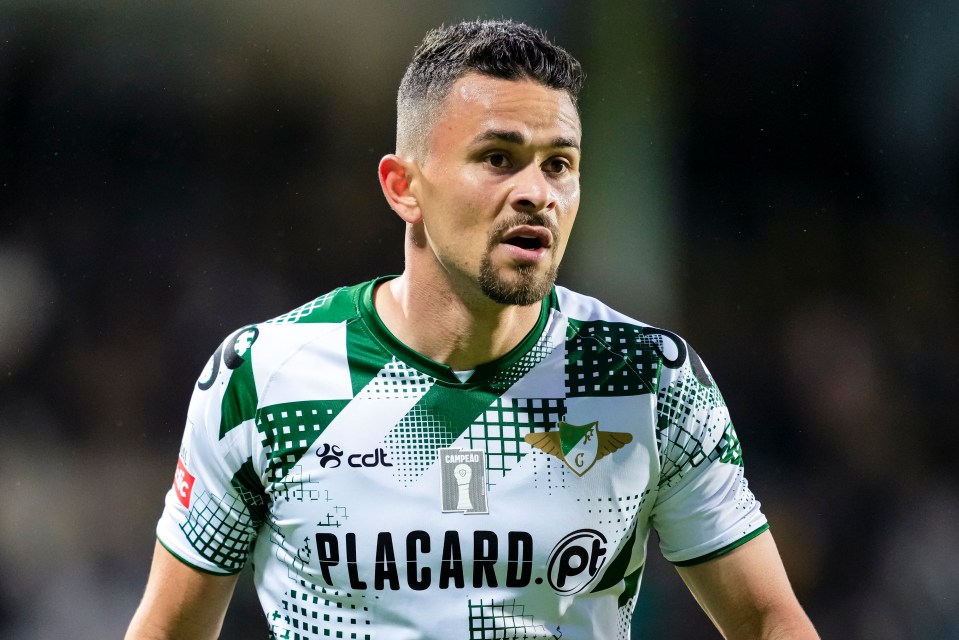 a man wearing a green and white placard jersey