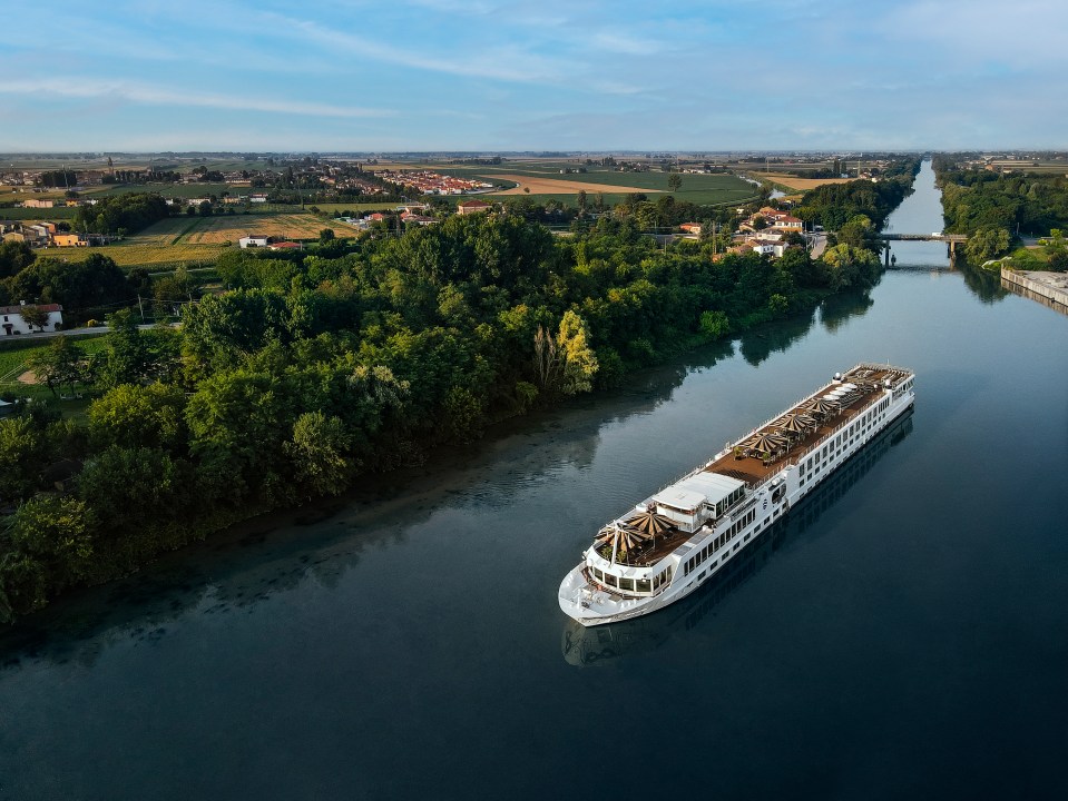 an aerial view of a cruise ship on a river