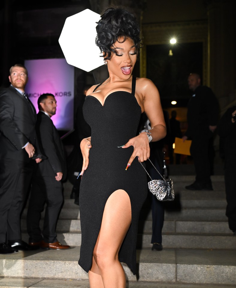 Megan Thee Stallion dazzled in a slinky black dress with a thigh-split