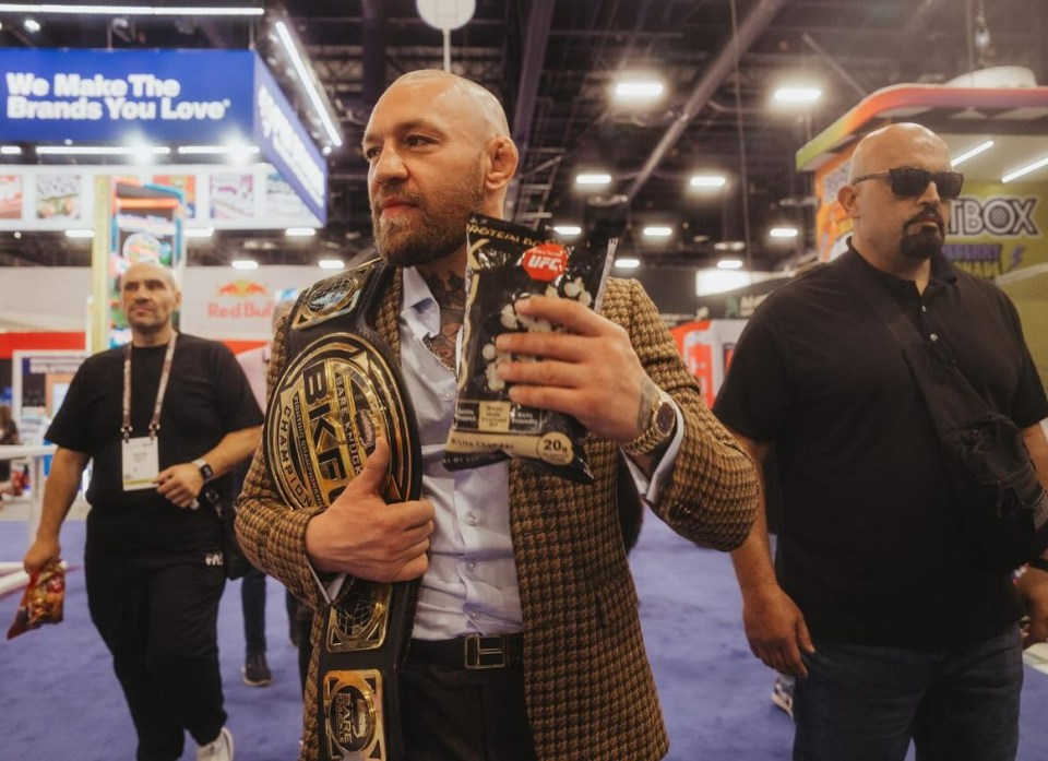 McGregor, wearing a BKFC belt on his shoulder, showed off his bald new look