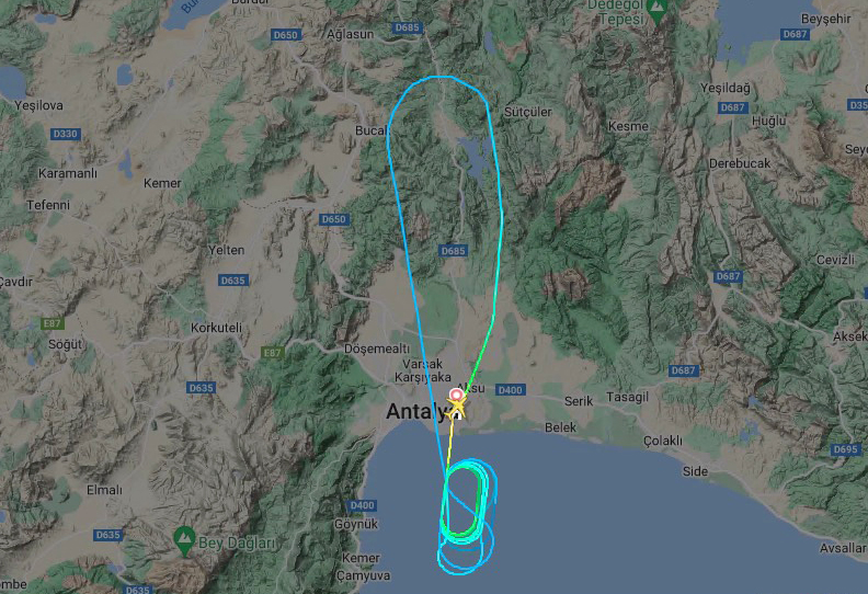 A flight map shows the plane turning back over inland Turkey