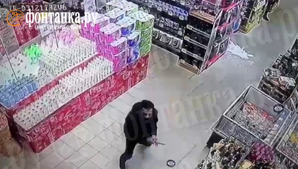 Smashed bottles of champagne can be seen over the supermarket floor