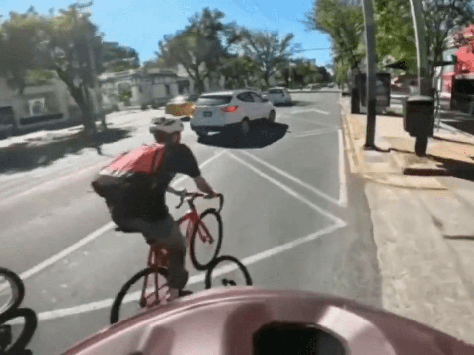 The white SUV pulled over in front of a group of cyclists