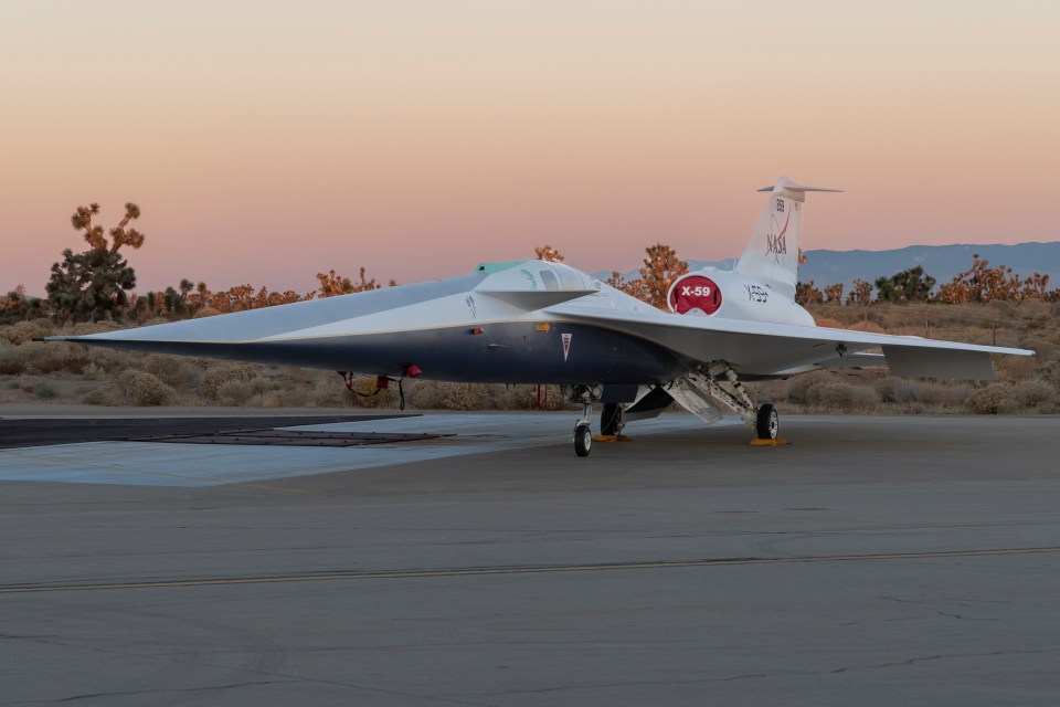 a nasa jet is parked on a runway