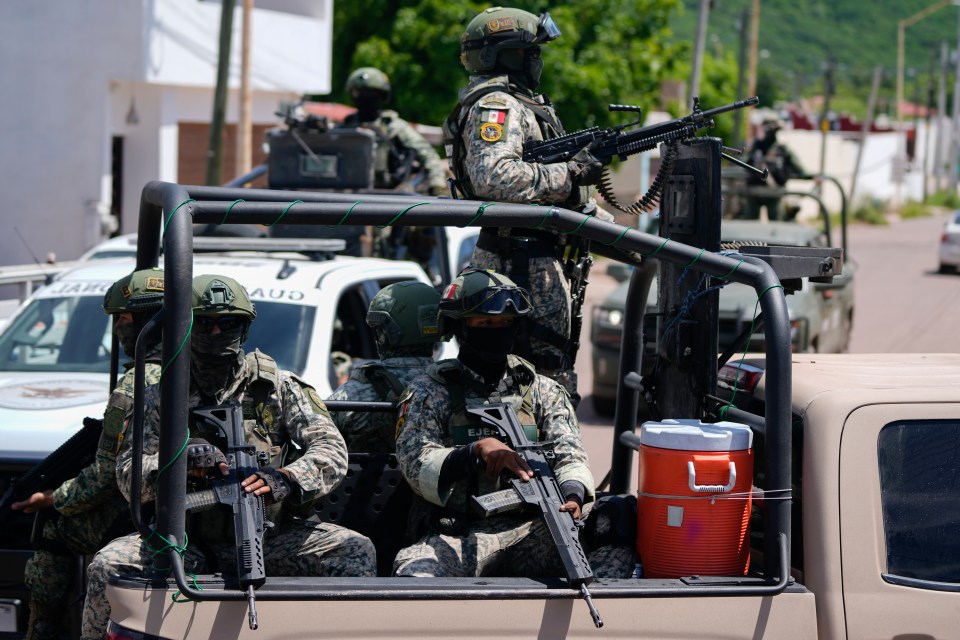 National Guards and Army forces patrol the streets during an operation in a neighborhood of Culiacan, Sinaloa state