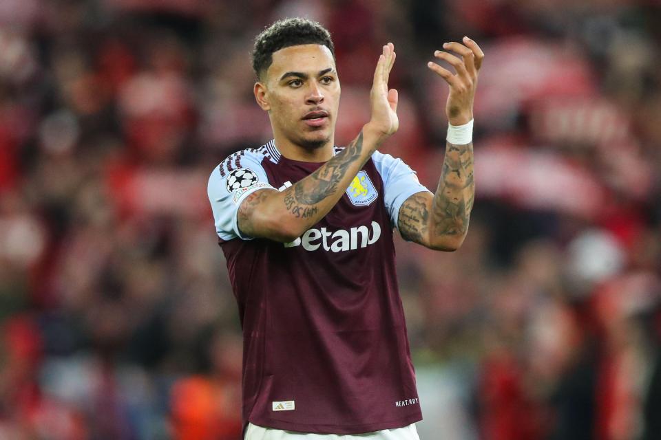 a soccer player wearing a maroon betan jersey