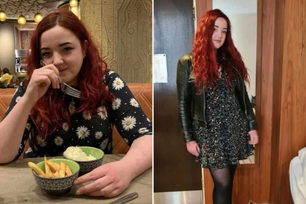 a woman with red hair is sitting at a table eating french fries