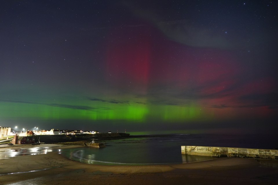 The Northern Lights on display in the skies over Cullercoats Bay in North Tyneside