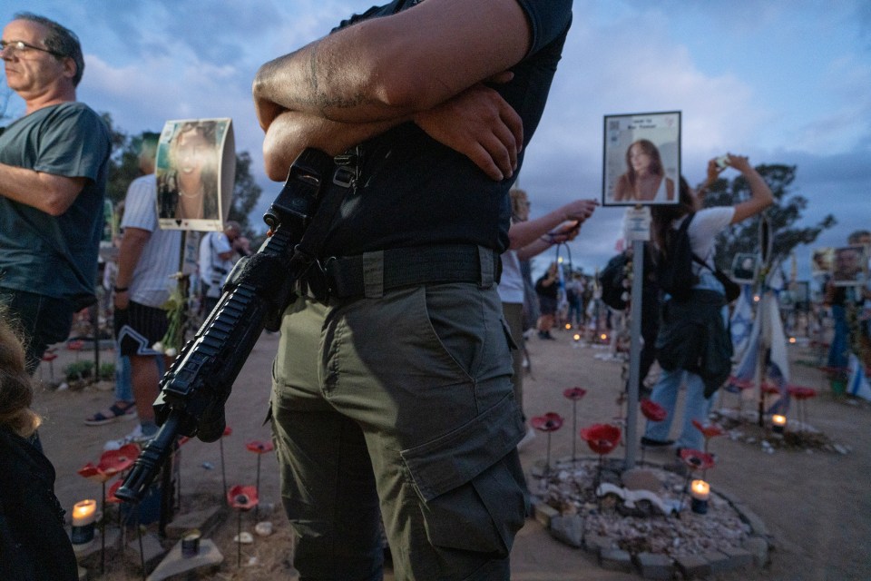 A soldier stands guard at the vigil