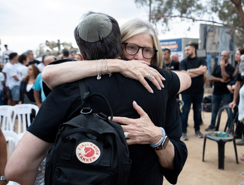 Lisa Marlowe, the mother of British Hamas victim Jake Morlowe, embraces a fellow mourner at the vigil one year on from the terrorist massacre