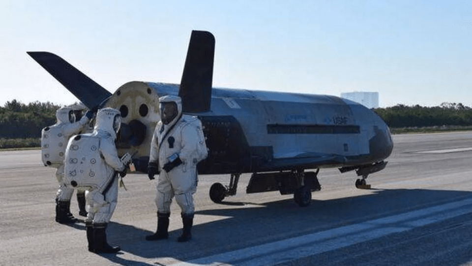 The X-3LB on the runway after landing with USSF workers standing at the rear