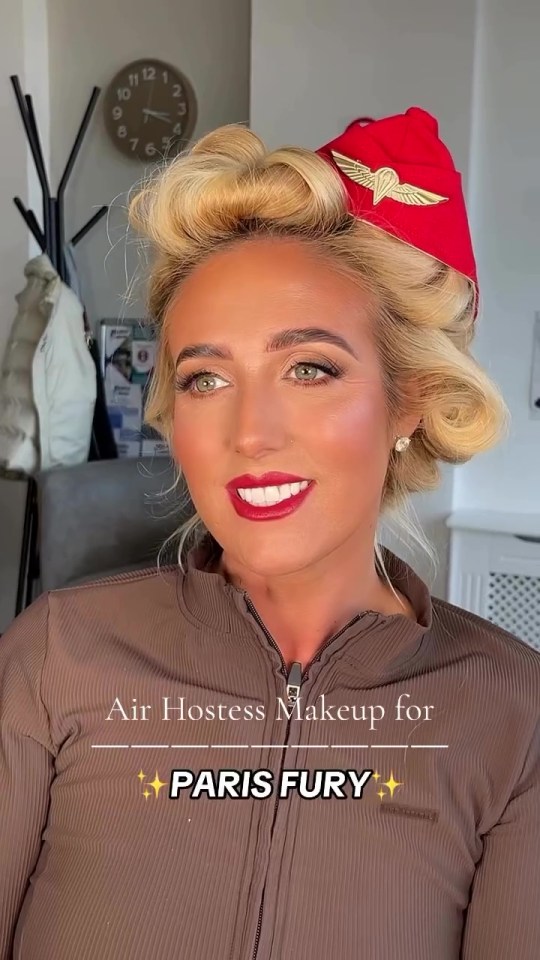 a woman wearing a red hat with the words air hostess makeup for paris fury