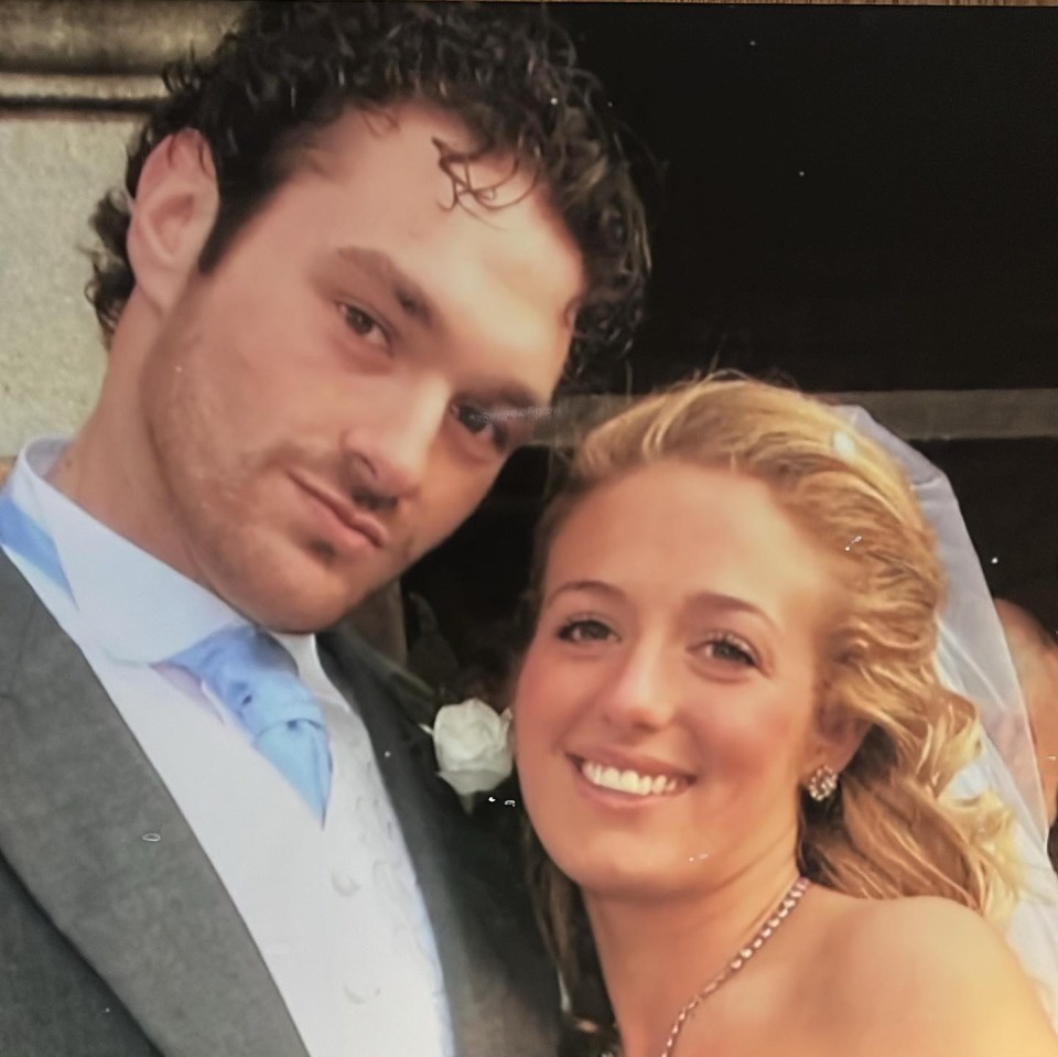 a man and a woman are posing for a picture in a hallway