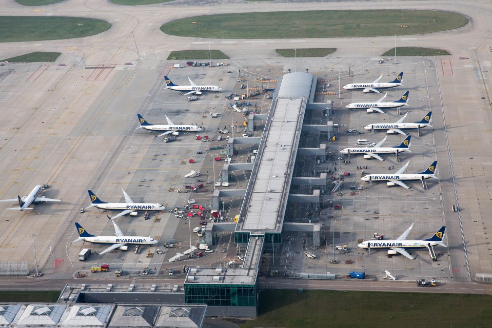 several ryanair planes are parked on the tarmac