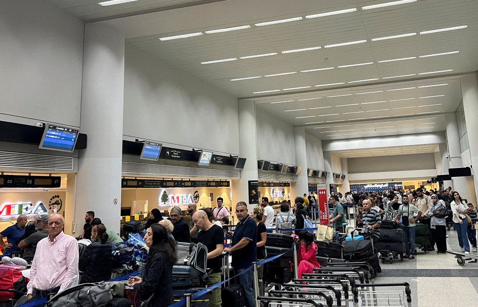 Passengers queue at the check-in counters at Beirut-Rafic Al Hariri International Airport, in Beirut