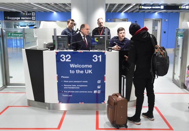 a welcome to the uk sign at an airport