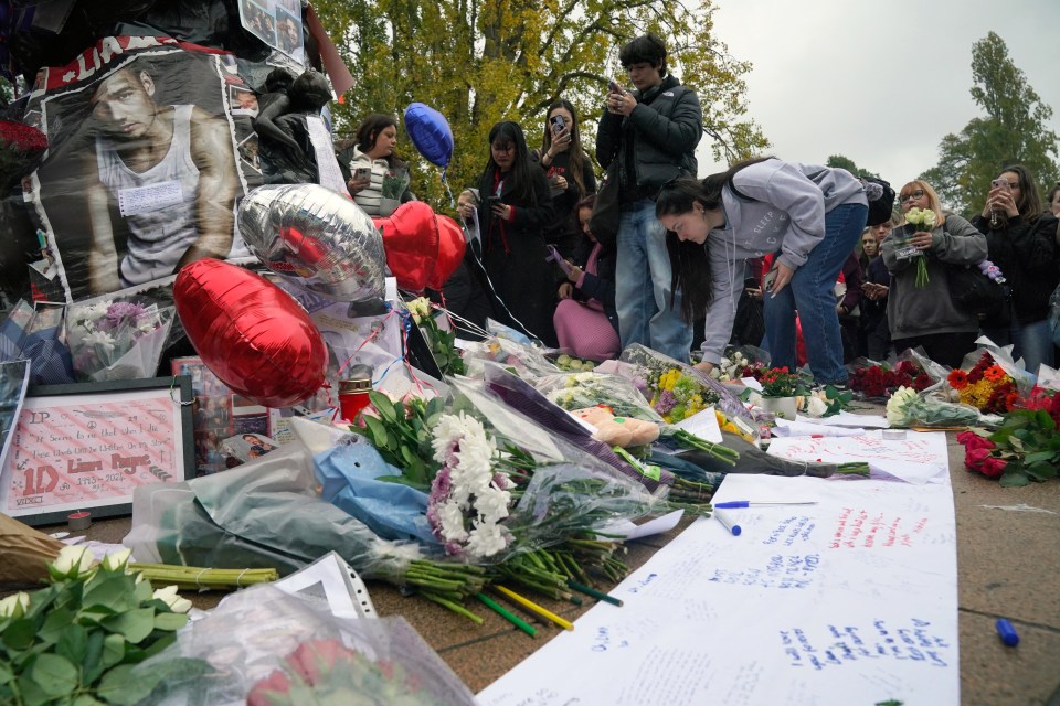 Tributes continue to gather underneath pictures of the star