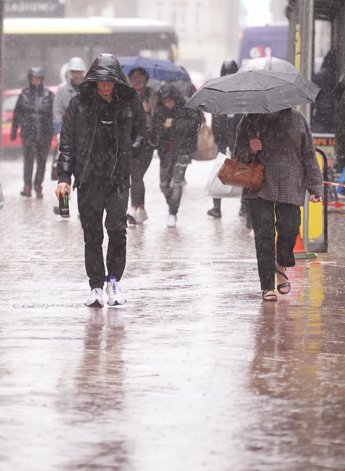 People braving the rain in Blackpool earlier today