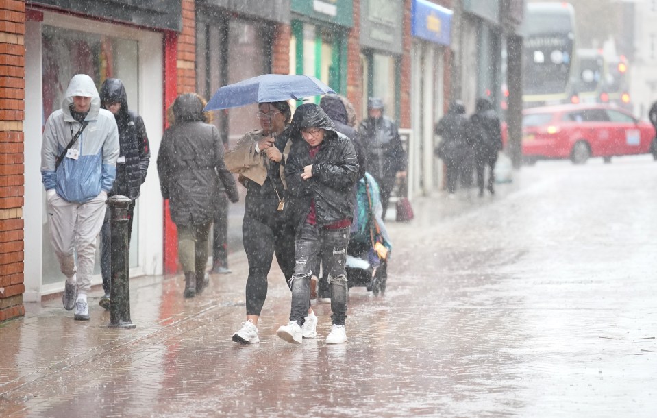 People walking in the rain in Blackpool earlier this month