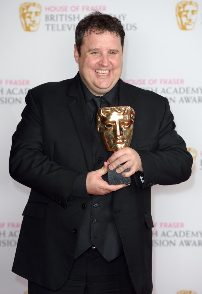 a man in a suit holds a trophy in front of a wall that says house of fraser