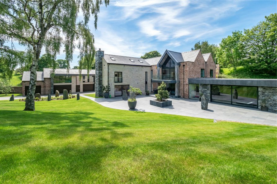 a large house with a large lawn in front of it