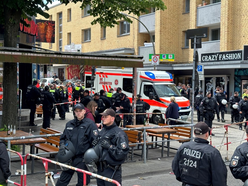 a group of police officers standing in front of a crazy fashion store