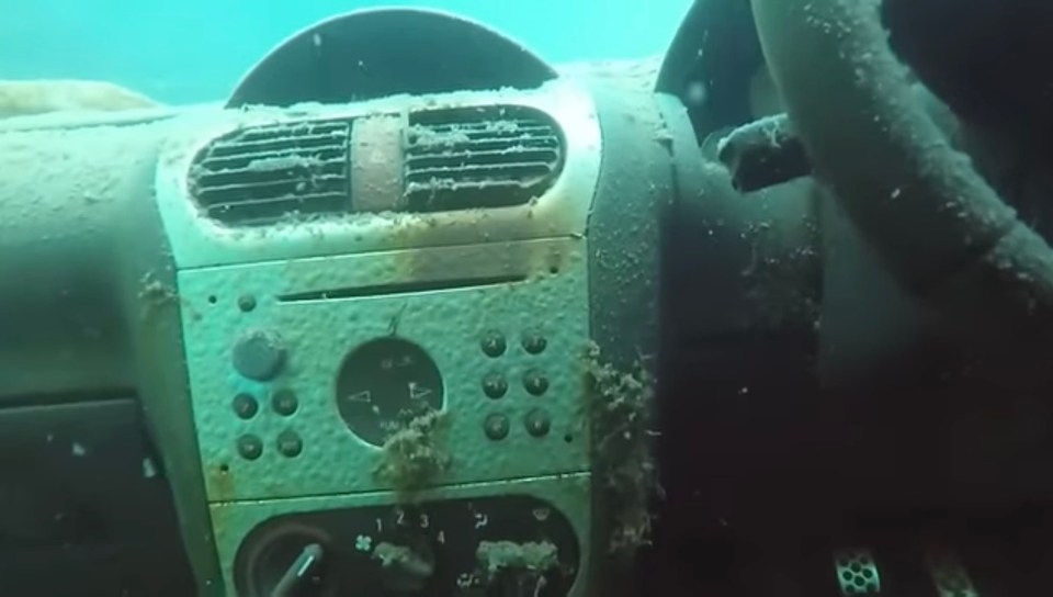 the dashboard of a car underwater with the numbers 1 2 and 3 visible