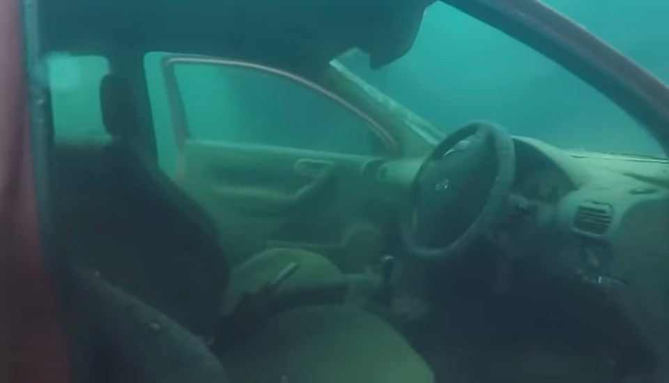 the inside of a car is visible through the water