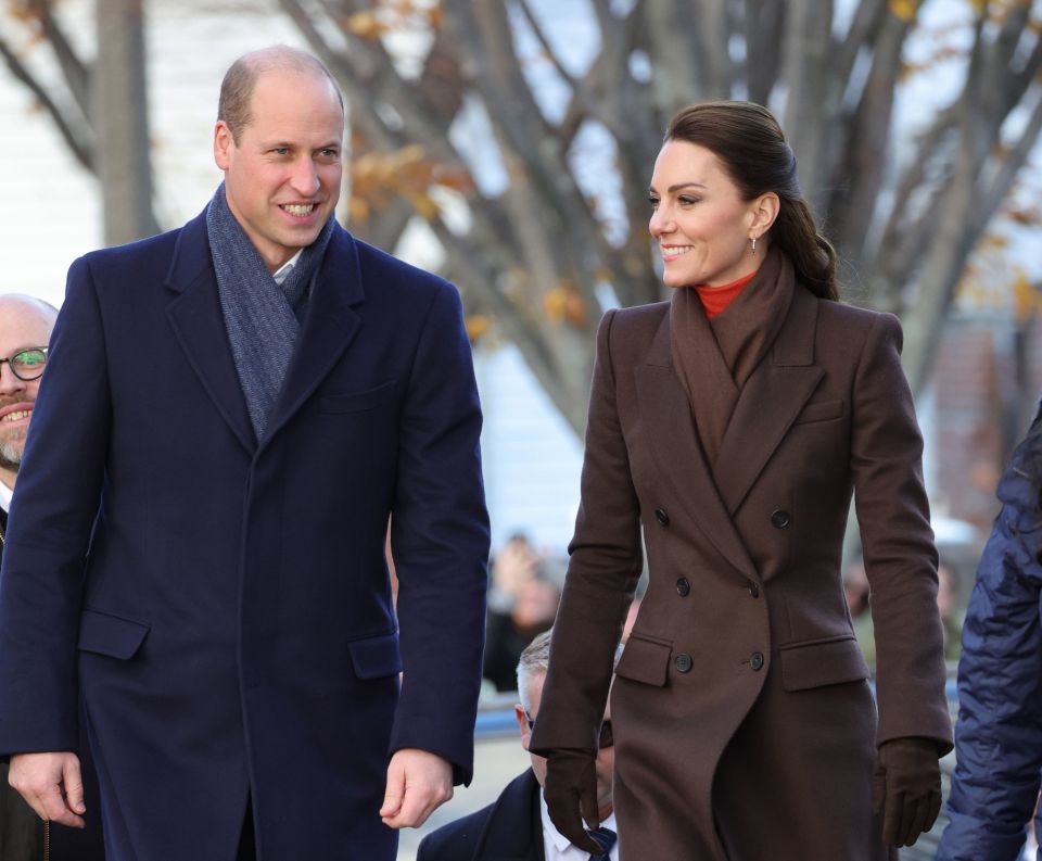 a man and a woman are walking together and smiling