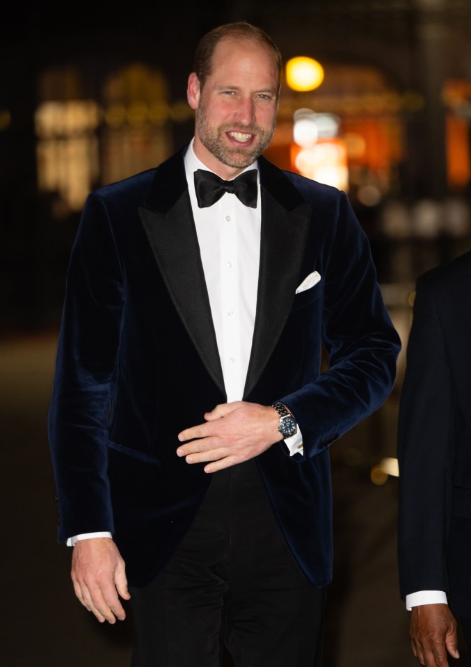 a man in a tuxedo with a watch on his wrist