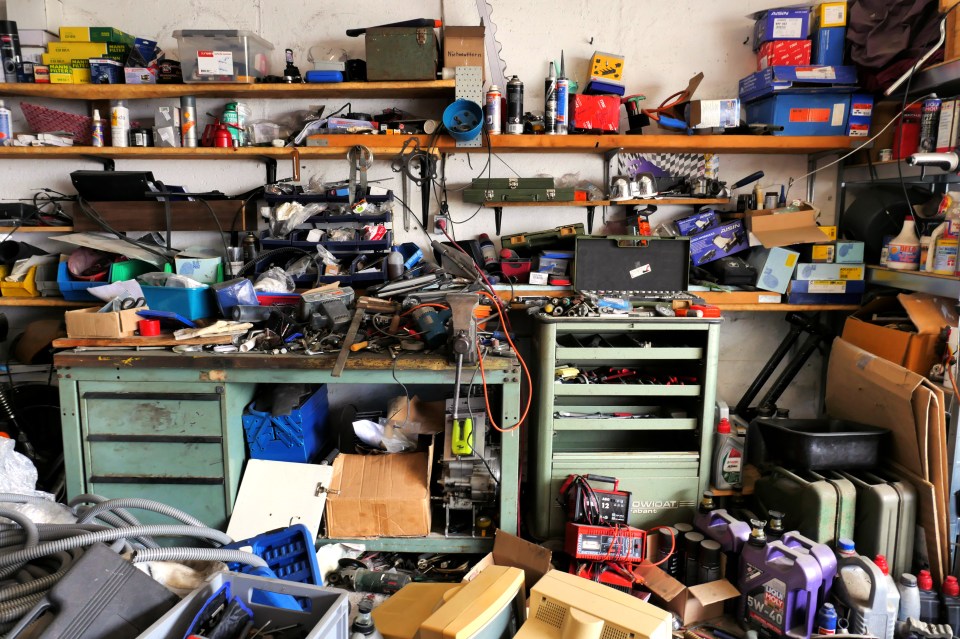 a messy garage with a toolbox that says ' bosch ' on it