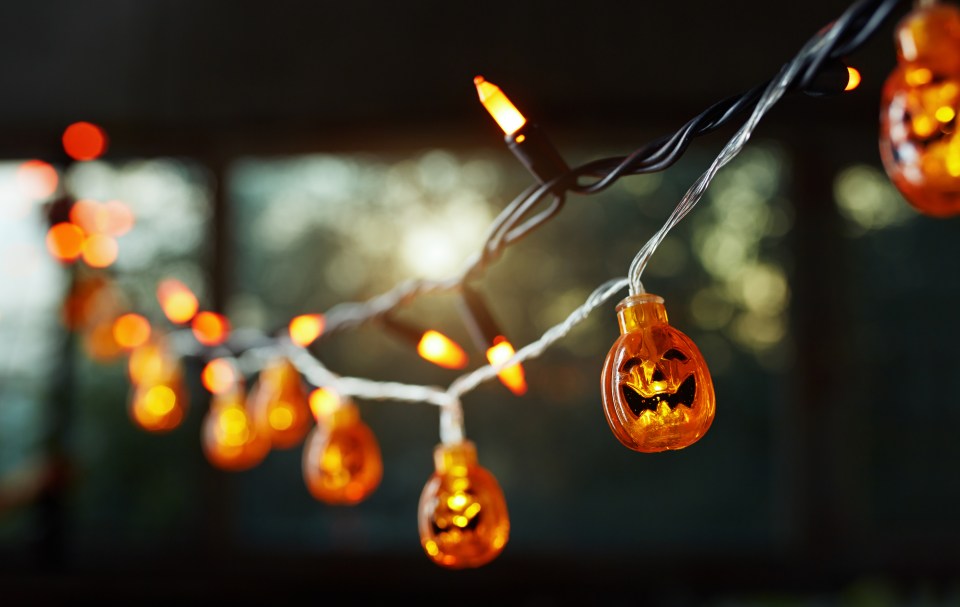 a string of halloween lights with pumpkins on them