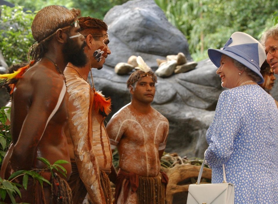 The Queen chats so aborigine dancers during her visit to Cairns, Queensland