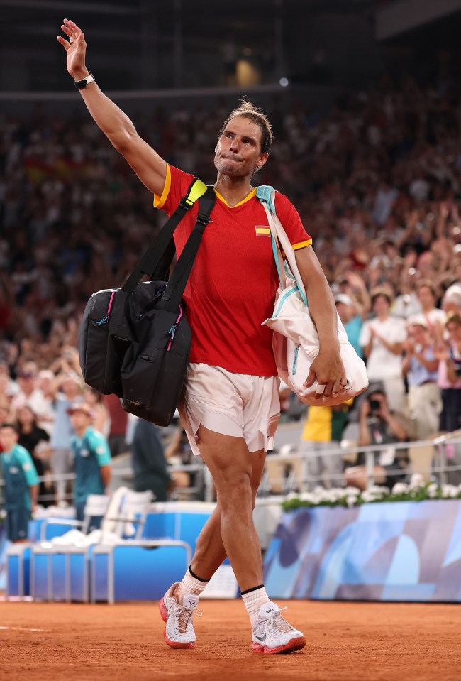 a man wearing a red and yellow shirt is carrying a bag