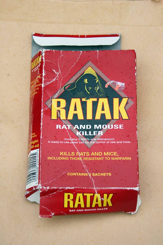 a red box of rat and mouse killer is opened