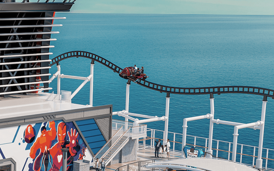 a roller coaster on a cruise ship with people riding it