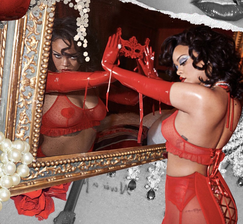 a woman in red lingerie is looking at her reflection in a mirror