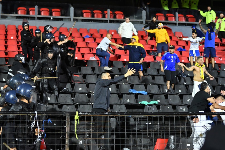 The Boca president raced down from his box to intervene as rival fans clashed