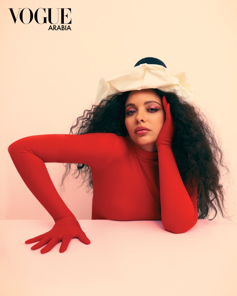 Jade Thirlwall posed in this red outfit and quirky hat for Vogue Arabia