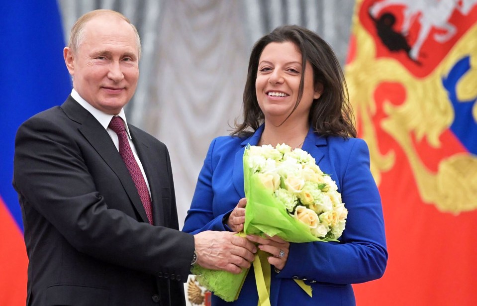 RT chief Margarita Simonyan, 44, pictured with Vladimir Putin